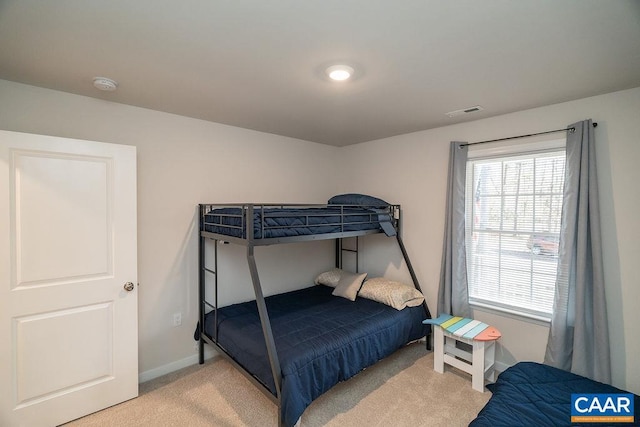 bedroom with light colored carpet