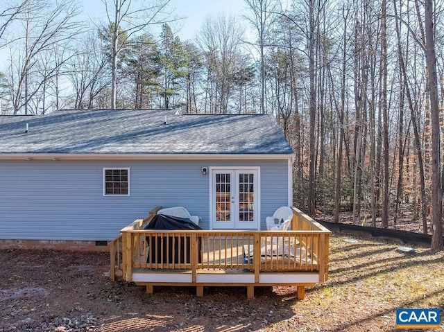 rear view of house with a wooden deck