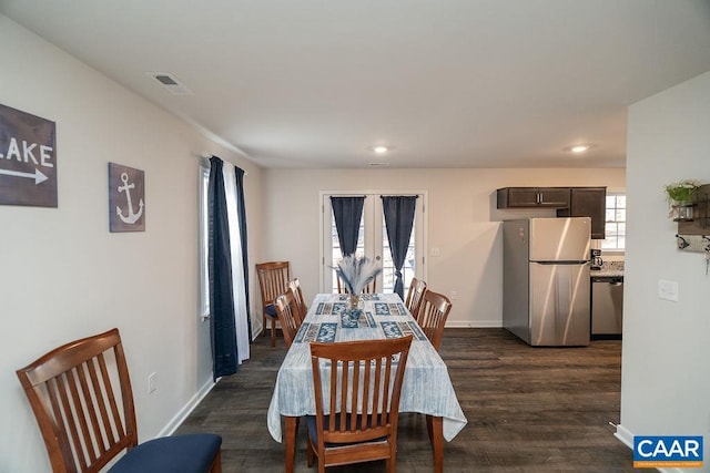 dining space featuring dark hardwood / wood-style flooring