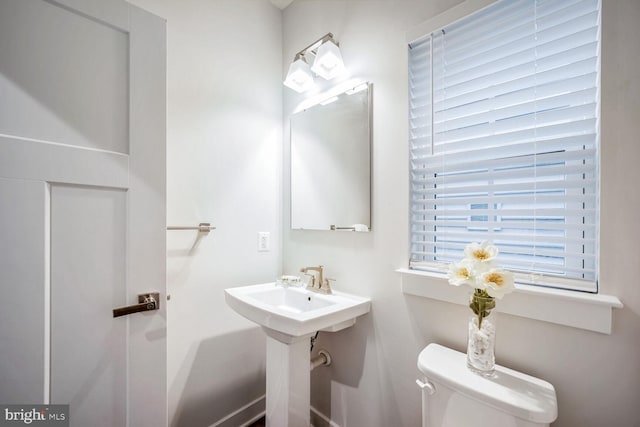 bathroom with toilet and sink