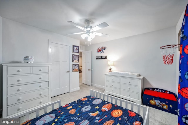 bedroom featuring light carpet and ceiling fan