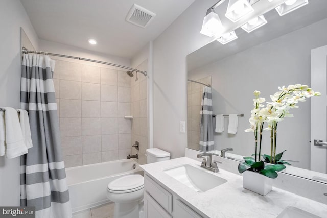 full bathroom featuring tile patterned floors, vanity, toilet, and shower / bathtub combination with curtain