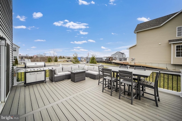 deck with an outdoor living space and grilling area