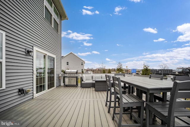 deck with an outdoor living space and grilling area