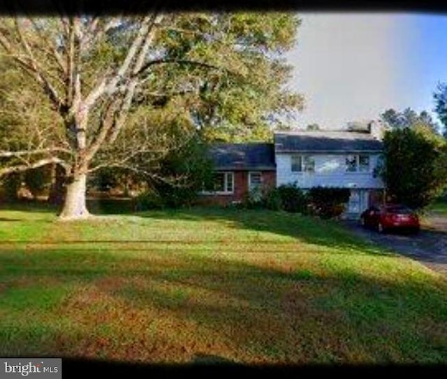 view of front of home with a front yard