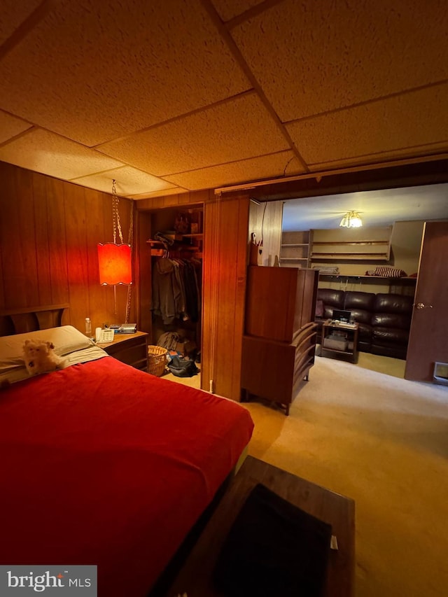 bedroom with wooden walls