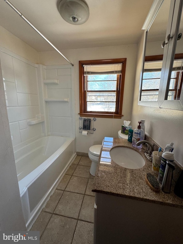 full bathroom with toilet, vanity, tile patterned floors, and shower / washtub combination