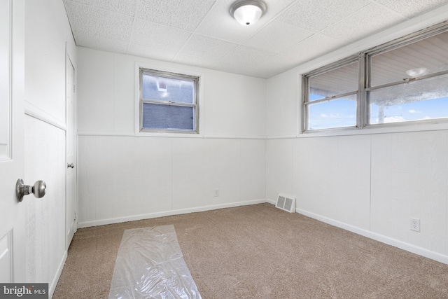 unfurnished room featuring carpet flooring