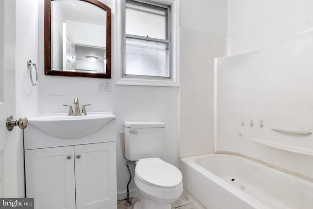 full bathroom with vanity, toilet, and  shower combination