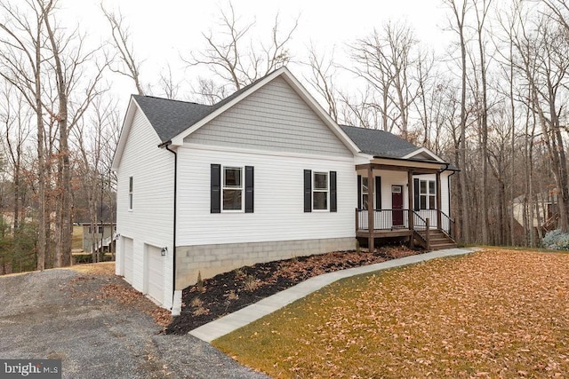 view of front of house with a porch and a garage