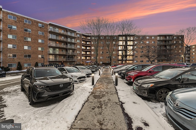 view of parking at dusk