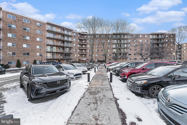 view of snow covered parking