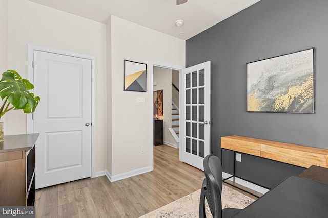 office space featuring light wood-type flooring and french doors