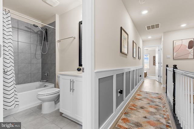 full bathroom with vanity, shower / bath combination with curtain, and toilet