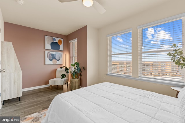 bedroom featuring ceiling fan and wood-type flooring