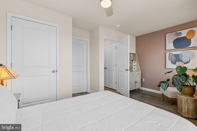 bedroom with ceiling fan and wood-type flooring