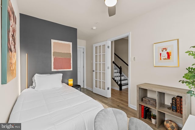 bedroom featuring ceiling fan and light hardwood / wood-style floors