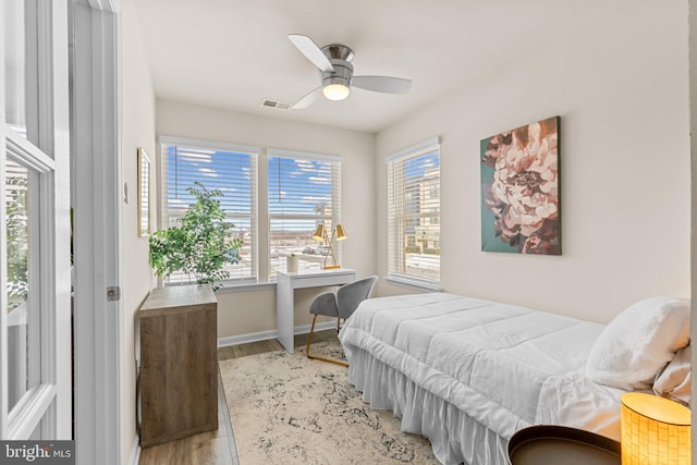 bedroom featuring ceiling fan and light hardwood / wood-style flooring