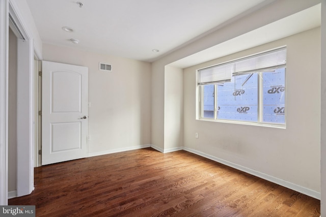 empty room featuring dark hardwood / wood-style floors