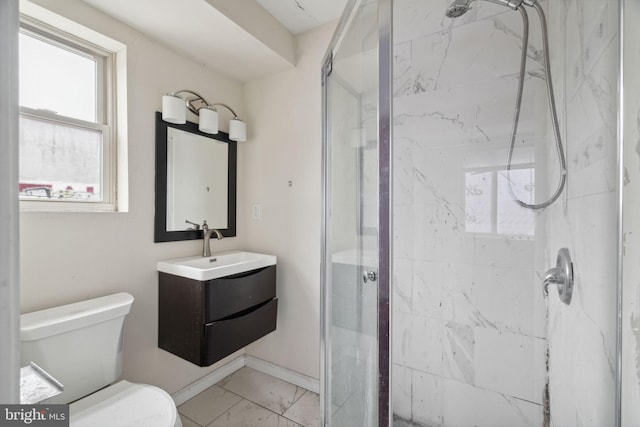 bathroom with vanity, a healthy amount of sunlight, and an enclosed shower