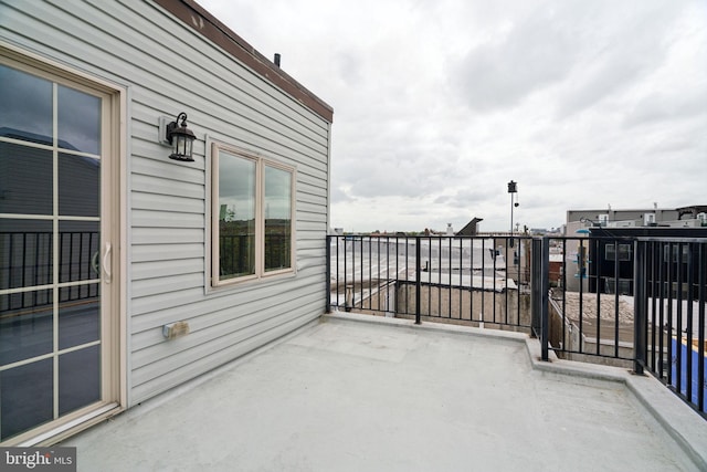 view of patio featuring a balcony