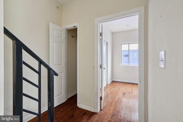 hall with dark hardwood / wood-style flooring