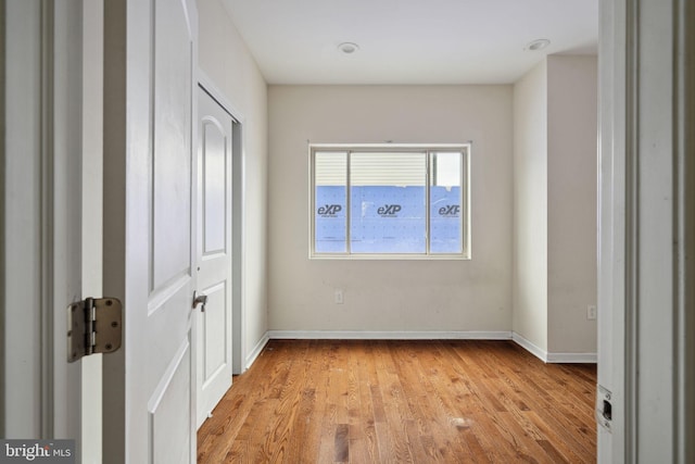 unfurnished bedroom with light wood-type flooring