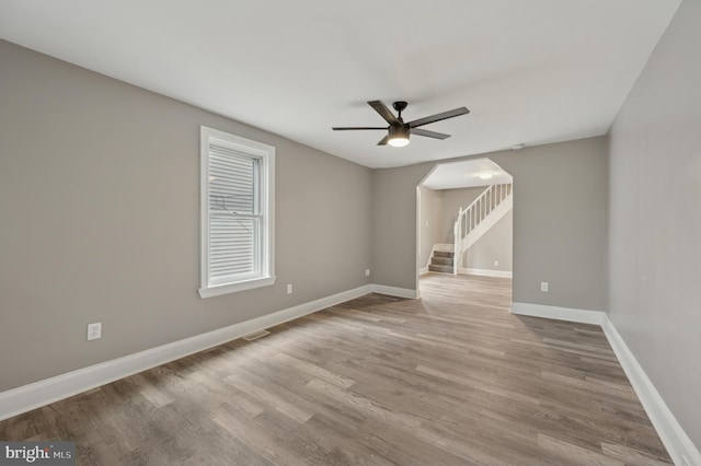 unfurnished room featuring ceiling fan and light hardwood / wood-style floors