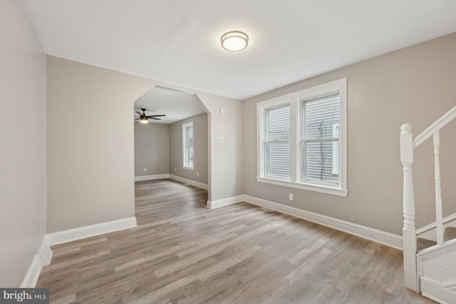 interior space with ceiling fan and light wood-type flooring