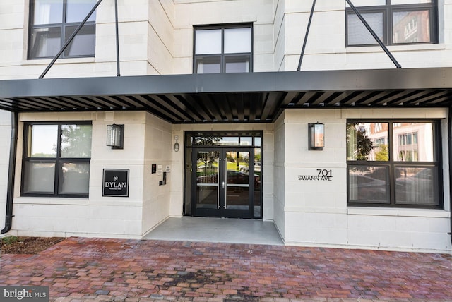 view of exterior entry featuring french doors