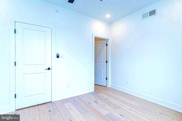 unfurnished room with ceiling fan and light hardwood / wood-style floors