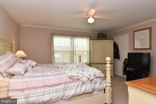 bedroom featuring ceiling fan, crown molding, and light carpet