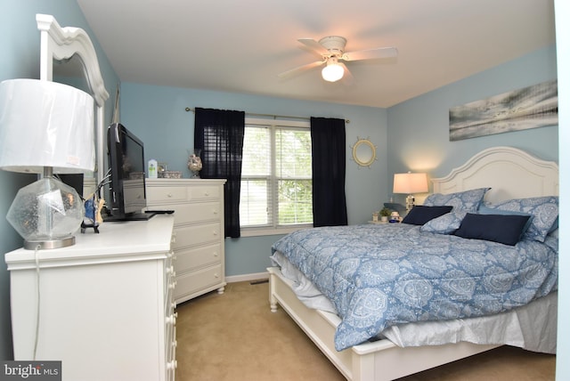 bedroom featuring ceiling fan and light colored carpet