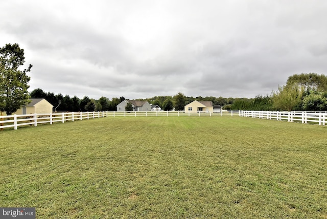 view of yard with a rural view