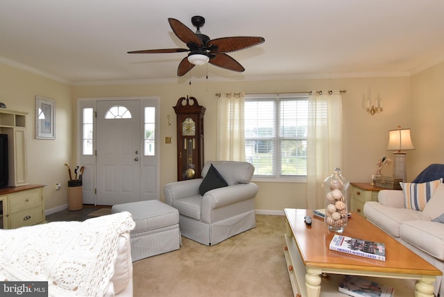 living room featuring light carpet, ceiling fan, and ornamental molding