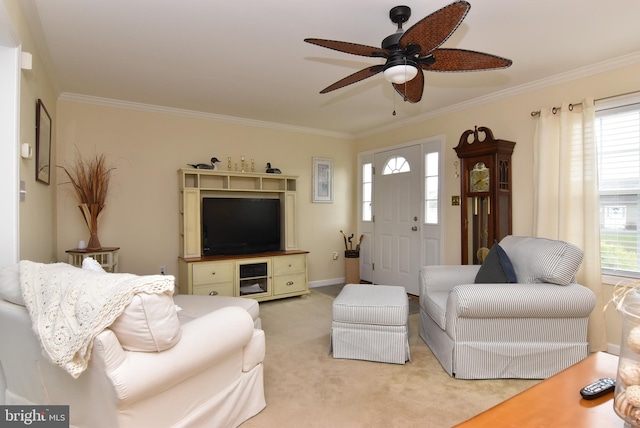 carpeted living room featuring a wealth of natural light, ceiling fan, and ornamental molding