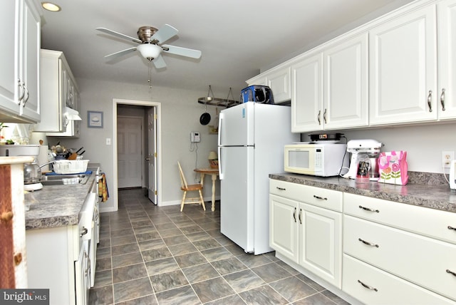 kitchen featuring ceiling fan, sink, white cabinets, and white appliances