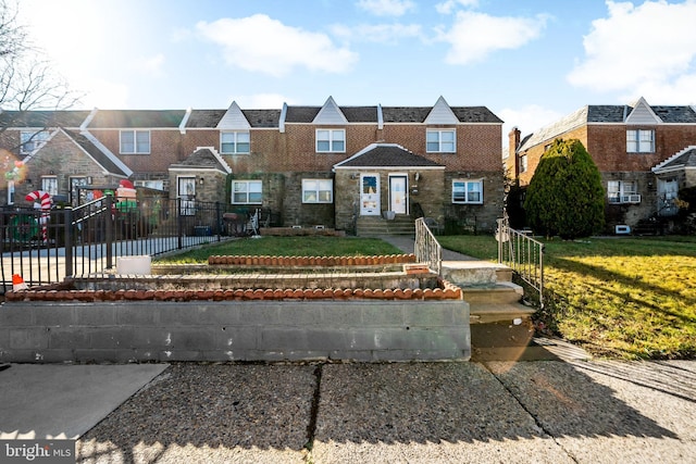 view of front facade with a front lawn