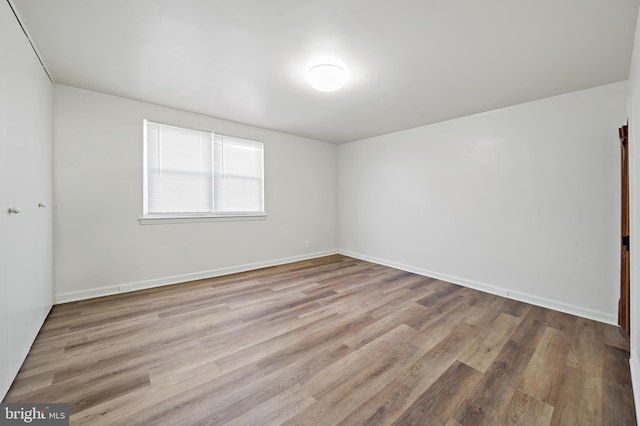 unfurnished room featuring light hardwood / wood-style floors