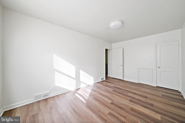 unfurnished bedroom featuring wood-type flooring