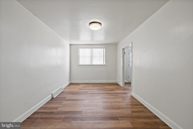 spare room with light hardwood / wood-style floors