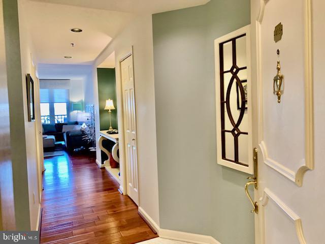 hallway featuring hardwood / wood-style flooring