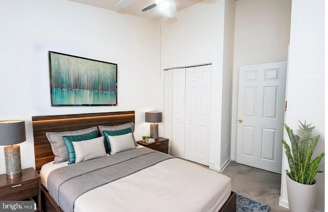 carpeted bedroom featuring a closet