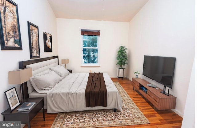 bedroom with hardwood / wood-style floors