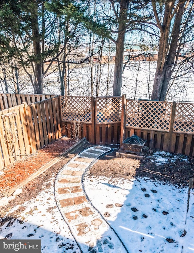 view of yard layered in snow