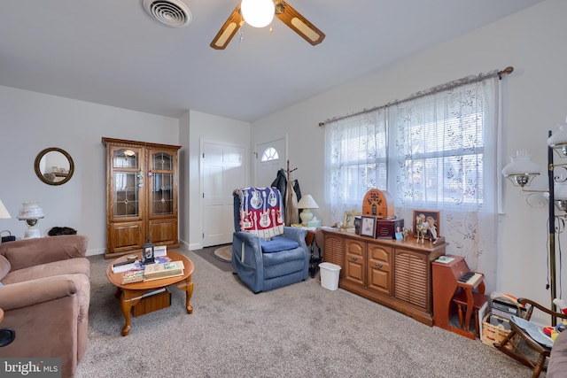 living room featuring ceiling fan and carpet floors