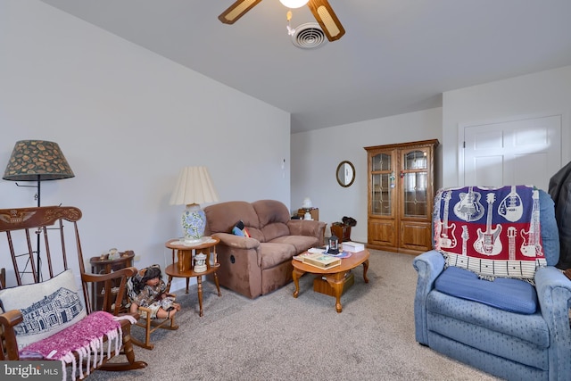 living room featuring light colored carpet and ceiling fan