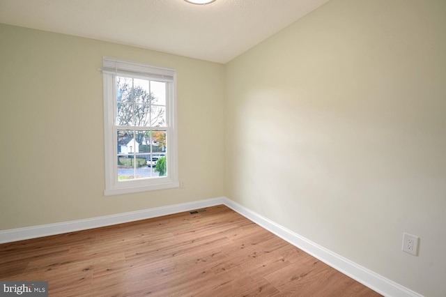 spare room featuring light wood-type flooring