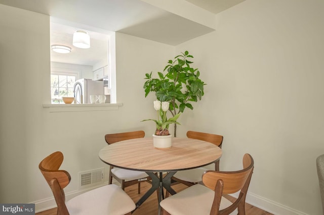 dining room featuring hardwood / wood-style flooring