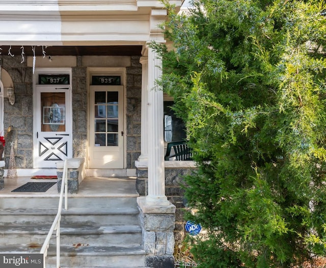 doorway to property featuring covered porch